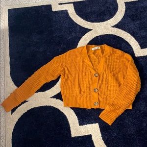 Orange button up sweater